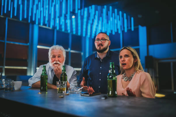 business people watching sports game in a bar - club soccer fotos imagens e fotografias de stock