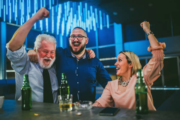 business people watching sports game in a bar - club soccer fotos imagens e fotografias de stock