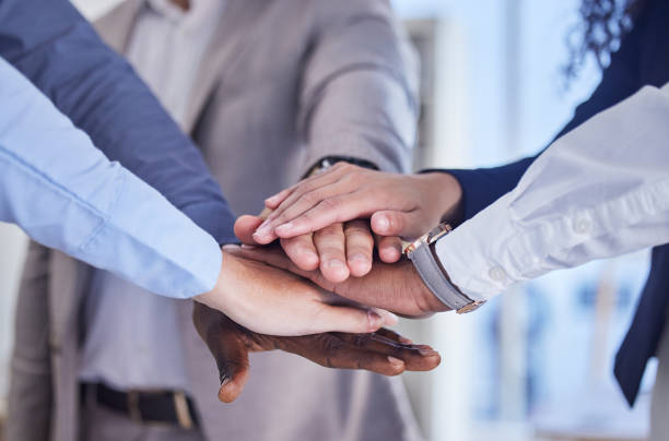 Business people, hands stack and team building motivation for goals, dream or mission in finance company. Corporate teamwork, diversity and solidarity for vision, strategy and collaboration in office gente de negocios, manos apiladas y motivación de formación de equipos para metas, sueños o misiones en la empresa financiera. trabajo en equipo corporativo, diversidad y solidaridad para la visión, estrategia y colaboración en la oficina