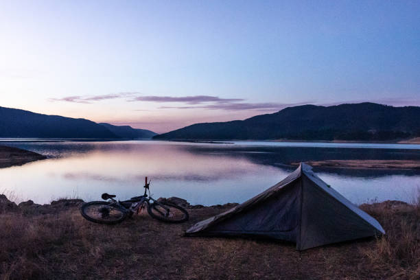 istock People and nature. Tent camping at lakeshore. 1483593278