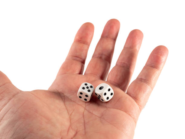 istock There are two dice in hand on a white background. 1483594805