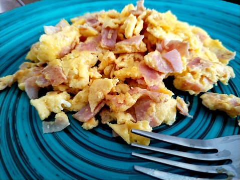 Scramble eggs with ham for breakfast