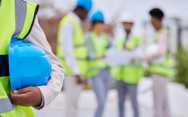 Construction, building and team of engineers on site for creative, planning and blurred background. Builder, safety and architect with group for thinking, problem solving and engineering on mockup