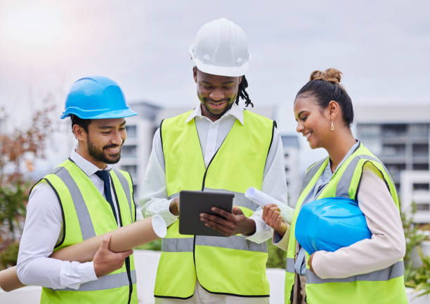istock Digital tablet, construction site and team of engineer at building creative, planning or strategy. People, collaboration or architect group online on thinking, problem solving or engineering on space 1483597429