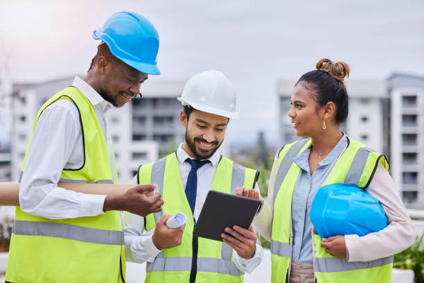 istock Construction site, digital tablet and team of engineers at building creative, planning and vision. Design, teamwork and architect group online for thinking, problem solving and engineering on mockup 1483597998