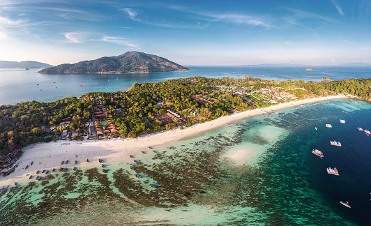 Panorama aerial view of beautiful Koh lipe island with tropical sea, fishing boat and resort on the beach in summer vacation at Satun, Thailand