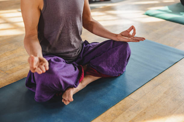 istock Mature Japanese Yoga Participant Seated While Meditating 1483599561