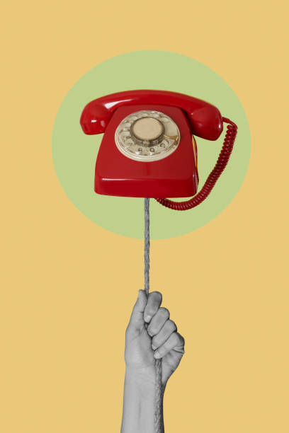 istock red telephone and hand in black and white 1483604839