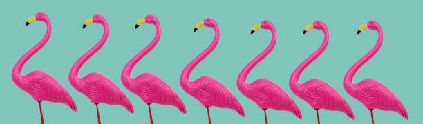 istock fake pink flamingos, web banner format 1483604900