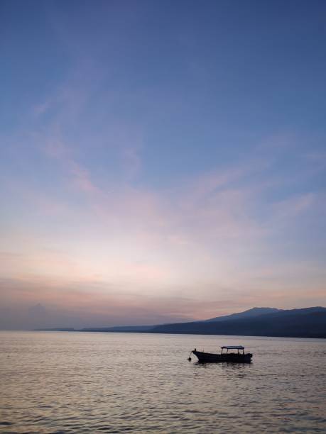 sunrise and boats on beach