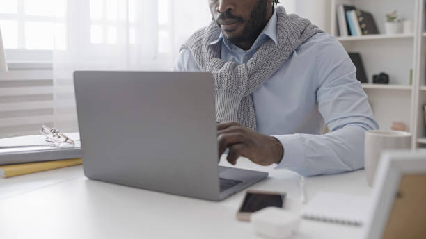 istock An African American man is working on his laptop, typing an article while sitting in his cozy home office 1483612288