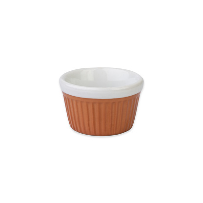 Old ceramic brown and white ramekin isolated over white background.