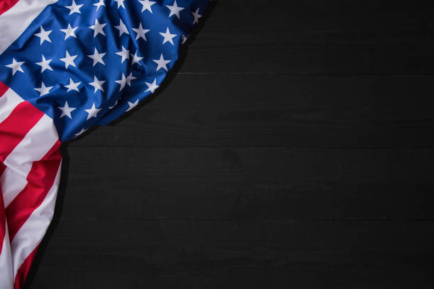 American flag for Memorial Day, 4th of July or Labor Day. Banner, USA flag on black background, copy space, top view. stock photo