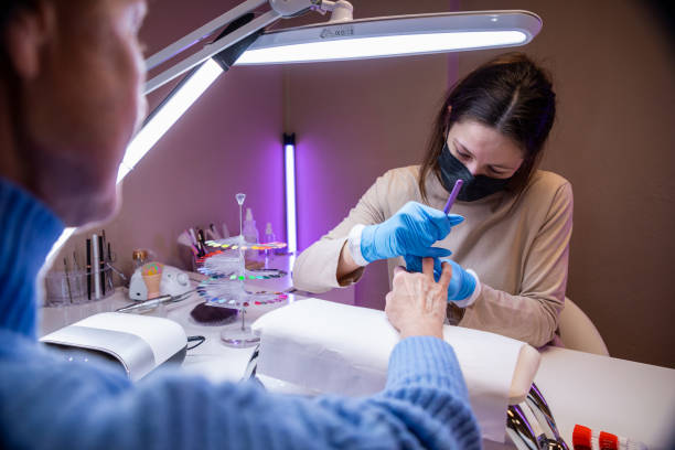 istock Manicurist doing nail art at her home nail salon 1483617775