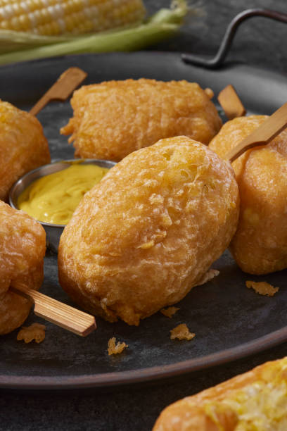 Beer Battered Corn on the Corn Beer Battered Corn on the Corn with Spicy Mustard Dip corn cob eaten stock pictures, royalty-free photos & images