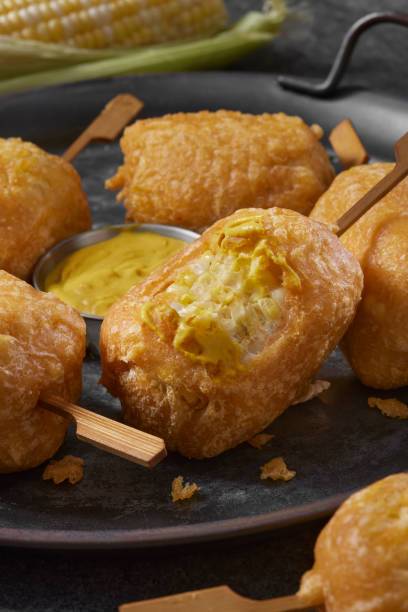 Beer Battered Corn on the Corn Beer Battered Corn on the Corn with Spicy Mustard Dip corn cob eaten stock pictures, royalty-free photos & images