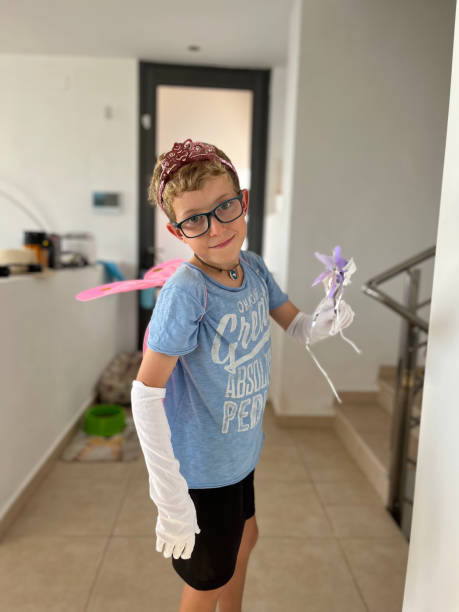 istock 10-year-old boy dressed up as a fairy at home 1483625197