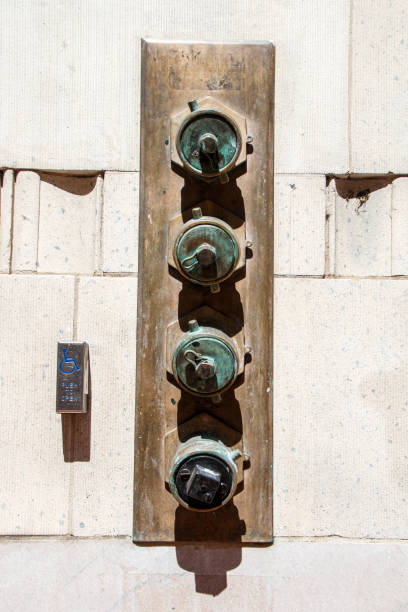 istock Four brass fire stand pipes with a brass plate 1483625512