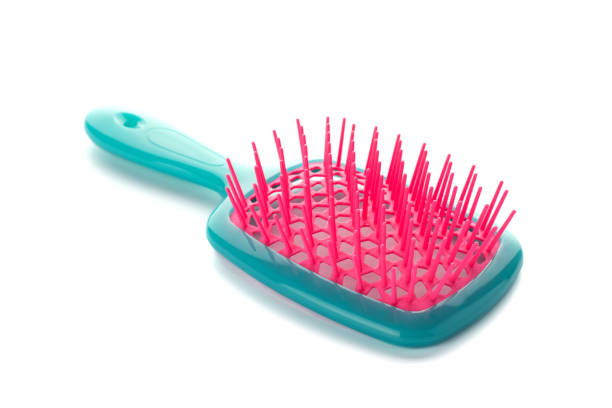 istock Plastic hairbrush isolated on white background. Colored comb on white background 1483627194