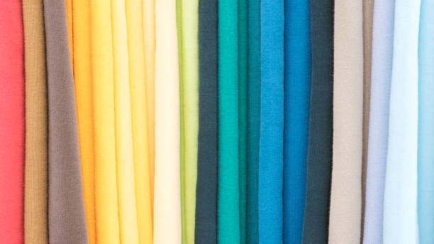 istock Mix colorful hanging vertical stripe textile, fabrics, cloths on the rack. Texture of multicolored fabrics close up. 1483627334