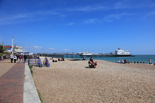 Eastbourne, UK - April 30, 2022: Pier is a seaside pleasure pier in Eastbourne, East Sussex, on the south coast of England.