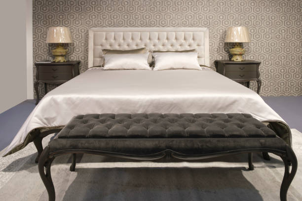 istock Big comfortable bed in hotel room 1483629426