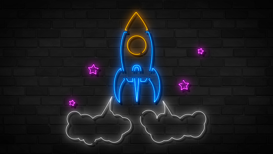 Rocket neon sign, bright signboard, light banner. Space logo, emblem. Rocket bar neon illustration on grey brick wall.