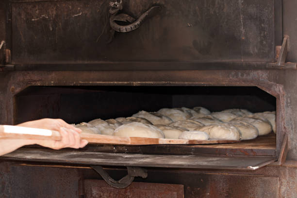 istock Baking Mastery: Crafting Artisanal Bread in a Traditional Oven 1483636387