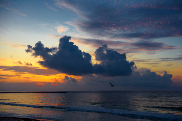 Sea beach with sky sunset or sunrise. Clouds over the sunset sea. Sunset at tropical beach. Nature sunset landscape of beautiful tropical sea.