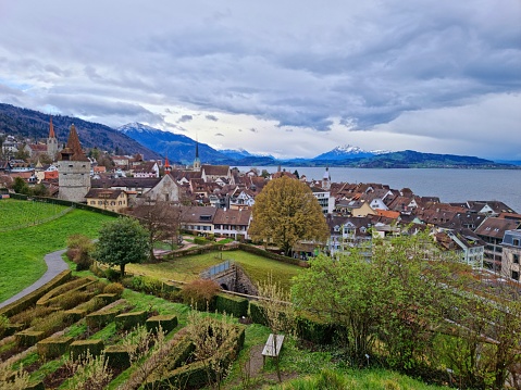 Zug City with its old town. Zug is a city in central Switzerland and has arround 30'000 residents. The image shows the old town of Zug with the lake Zug, captured during spring season.