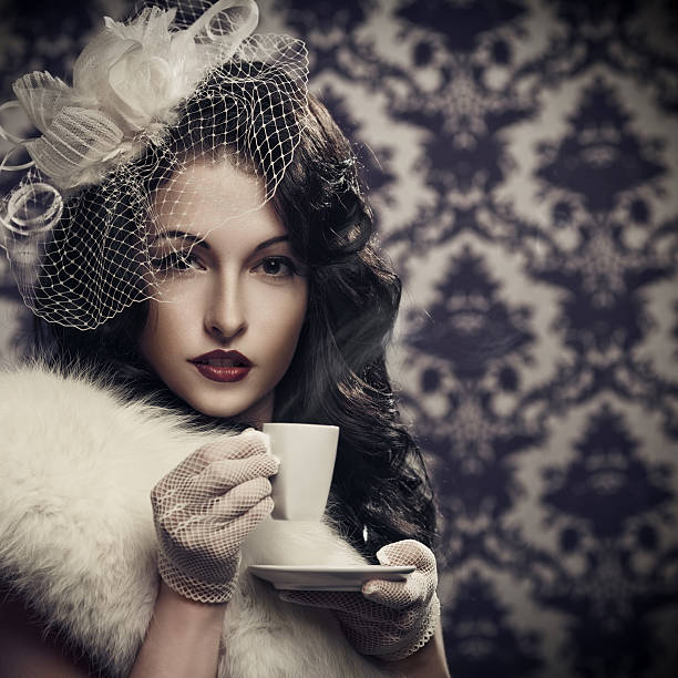 istock Young beautiful retro lady drinking coffee 148364172