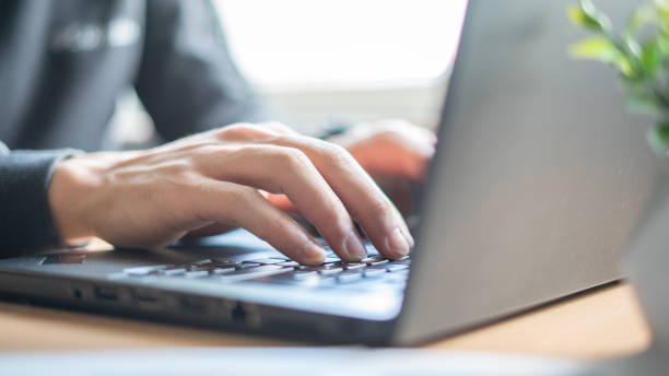 istock Close-up Man is using laptop at home 1483643897