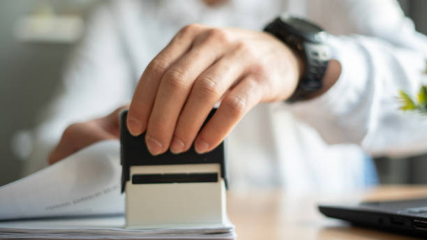 istock Close-up Businessman stamps files 1483644271