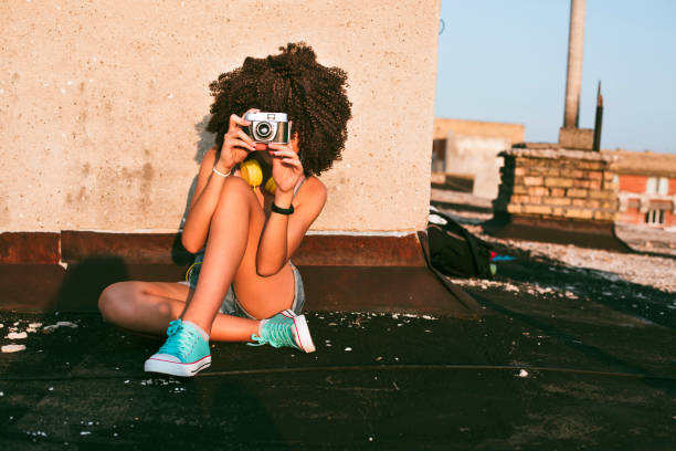 Girl on a rooftop stock photo