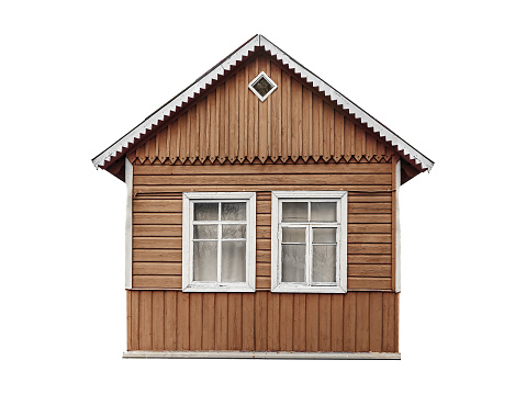 Old small brown wooden village house built of planks isolated on white.