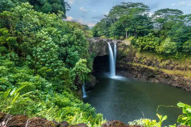Photo of Rainbow (Waianuenue) Falls is a waterfall, Hilo, Hawaii, USA. The Wailuku River rushes into a large pool below.