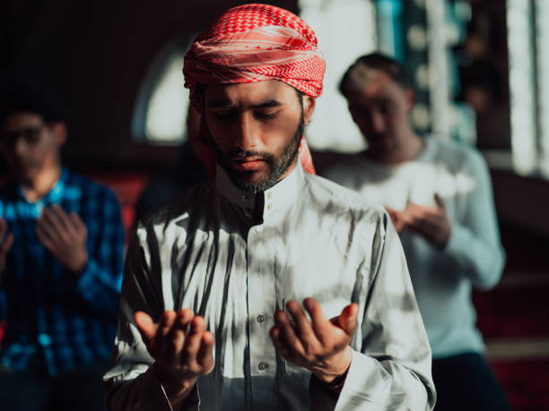 istock Muslim Arabic man praying. Religious muslim man praying inside the mosque during ramadan 1483647747