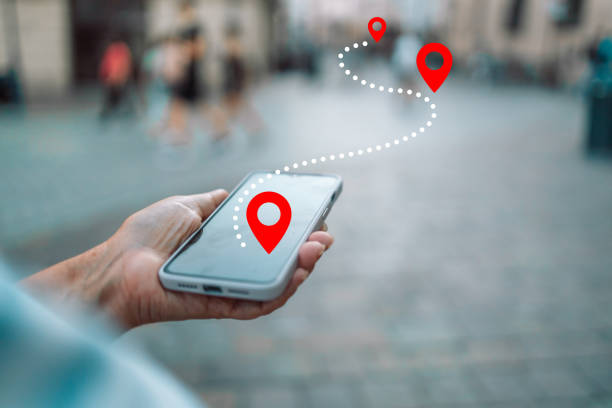 Woman tourist use maps app to navigate city, plan route from location to destination Tourist using navigation app on the mobile phone. High quality photo internet everywhere stock pictures, royalty-free photos & images