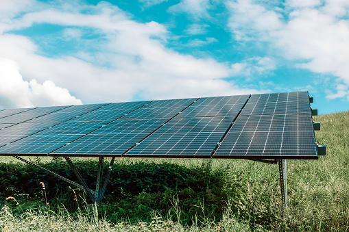 Solar panels on the sky background. Solar power plant. Blue solar panels. Alternative source of electricity. Solar farm. High quality photo