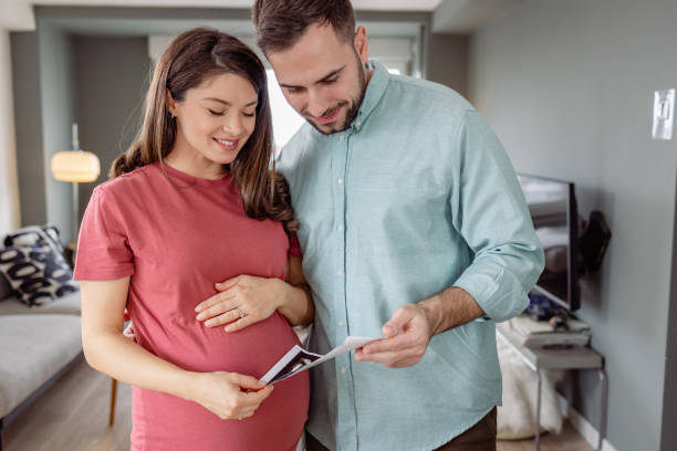 istock Happy future parents holding their ultrasound 1483656492