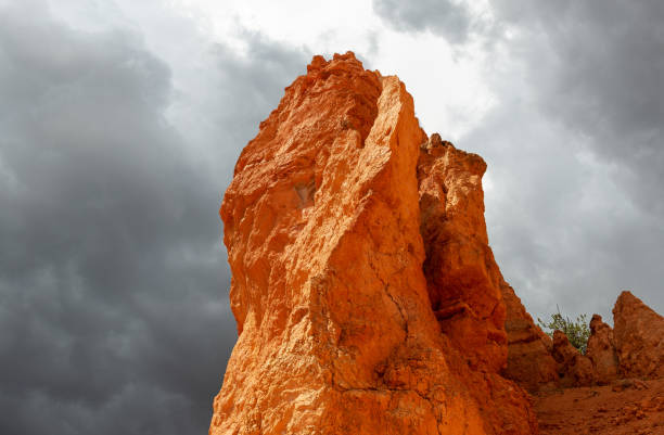 Hoodoo rock formation at sunset with dramatic thunder storm clouds, Bryce canyon national park, Utah, USA.