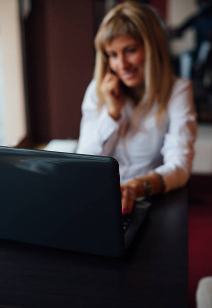 istock Woman using laptop and mobile phone at the same time with copy space 1483668706