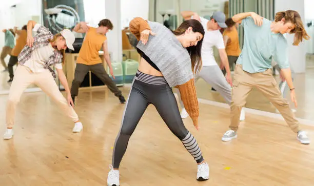Photo of Expressive teen girl dancing krump in choreographic studio