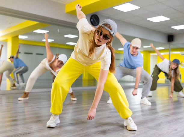 istock Young girl training breakdance drops in dance hall 1483674927