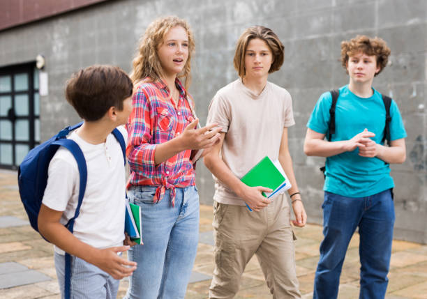 istock Students of middle school chatting and spending happy time together outside 1483676568
