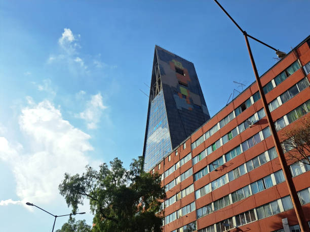 Mexico City, Mexico - Apr 06 2023: The Insignia Tower or Torre Banobras is a skyscraper in the shape of a triangular prism in Tlatelolco has the largest carillon in America