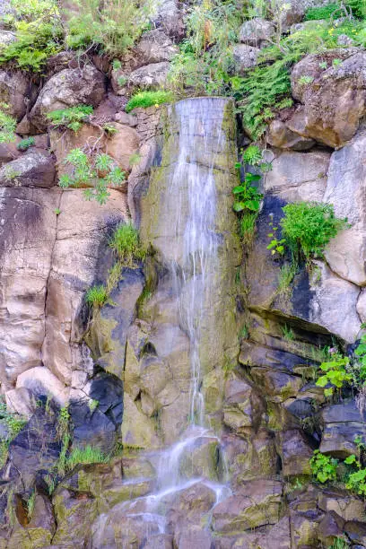 Photo of Beautiful view on cascading waterfall in cactus park of Las Palmas, Gran Canary, Spain