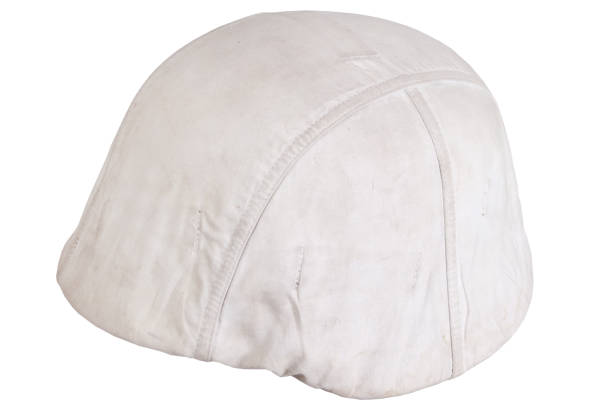 istock German army helmet with white camouflage cover, type winter. Isolated on white background 1483695276