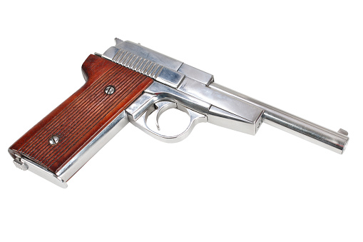 Vintage retro handgun isolated on white background