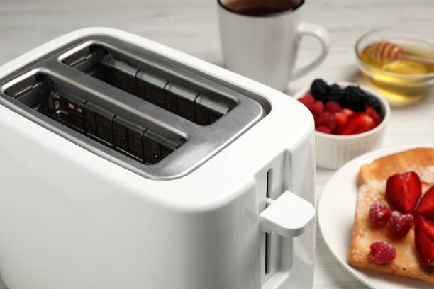 istock Modern toaster and products on table, closeup 1483695342
